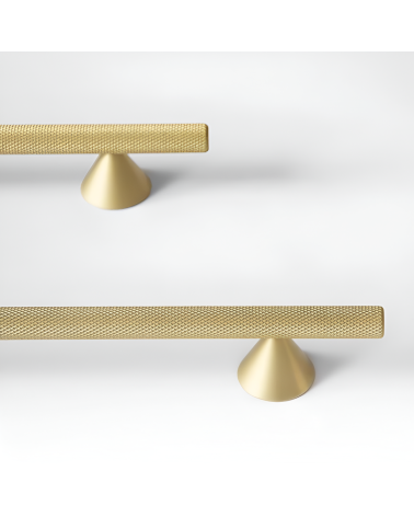 Maniglia per mobile anodo oro/oro opaco ONDIN maniglia design disposta su una superficie bianca