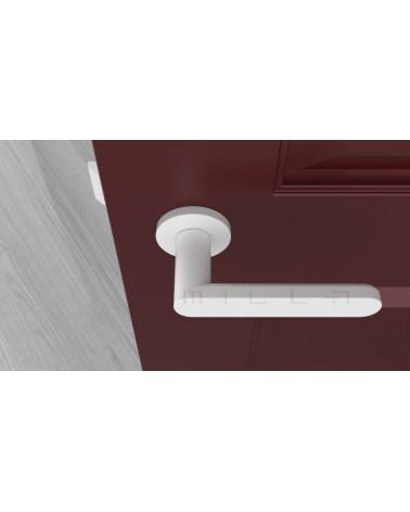 Maniglia porta colore bianco ALORA design vista dall'alto montata su una porta
