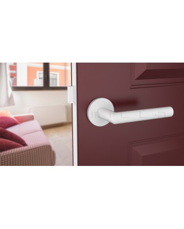 Maniglia per porta colore bianco ARABIS maniglia design vista dall'alto inclinata montata su una porta