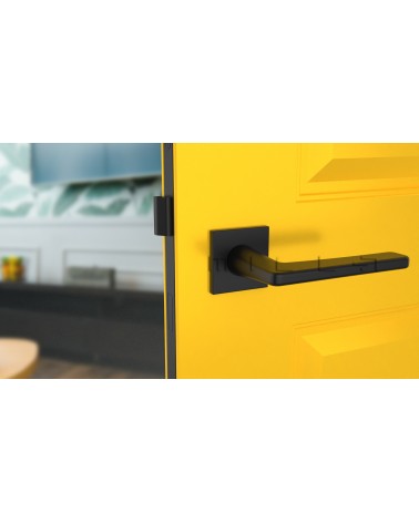 Maniglia per porta nera SETIA maniglia design vista frontale montata su una porta