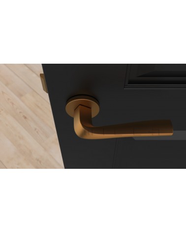 Maniglia porta rame DALIA maniglia design vista dall'alto montata su una porta