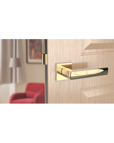 Maniglia per porta oro lucido HOSTA ferramenta design vista frontale montata su una porta