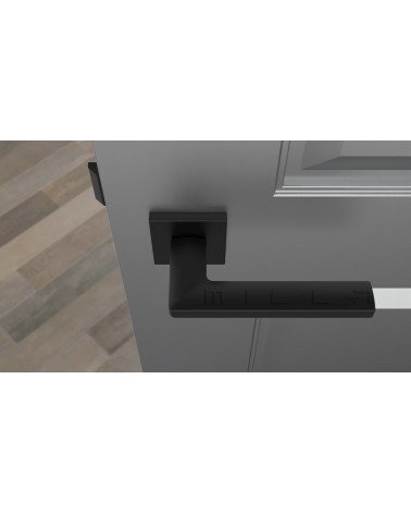 Maniglia per porta nera PYROLA ferramenta design vista dall'alto montata su una porta