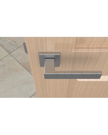 Maniglia per porta cromata satinata PINA maniglia design vista dall'alto montata su una porta