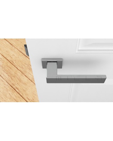 Maniglia per porta cromo lucido PINA design vista dall'alto montata su una porta