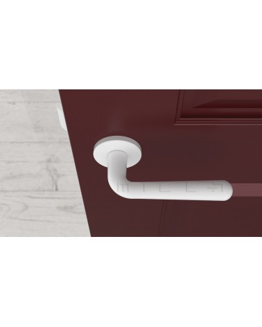 Maniglia per porta IRGA design bianco opaco vista dall'alto montata su una porta