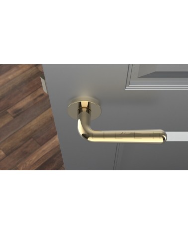 Maniglia per porta oro lucido IRGA design vista dall'alto montata su una porta