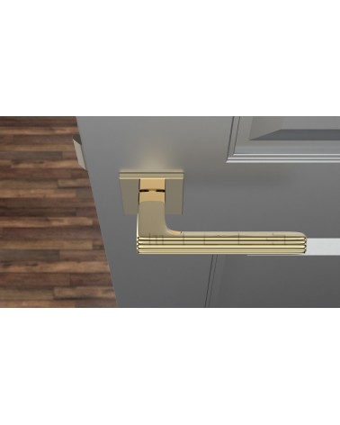 Maniglia per porta oro lucido LARICE design vista dall'alto montata su una porta
