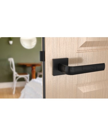 Maniglia per porta classica MELA ferramenta design vista frontale montata su una porta