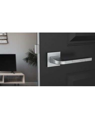 Maniglia per porta ISMENA design colore 1 vista frontale montata su una porta