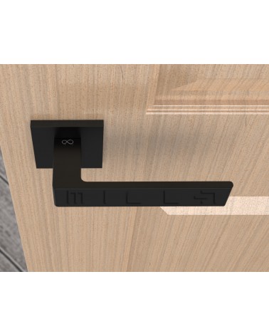 Maniglia per porta nera Apollo design vista dall'alto montata su una porta