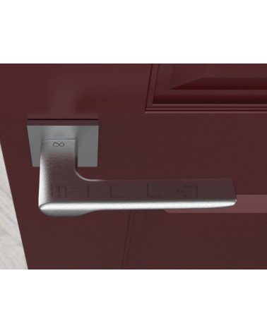 Maniglia per porta cromata spazzolata LIGNE design vista dall'alto montata su una porta