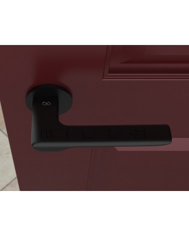 Maniglia per porta nera LIGNE design vista dall'alto montata su una porta