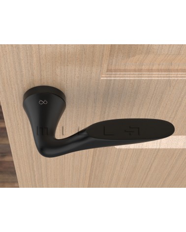 Maniglia per porta nera DOUCE maniglia design vista dall'alto montata su una porta