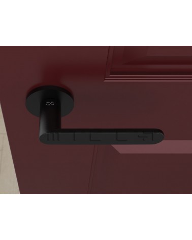 Maniglia per porta nera Line Vénus maniglia design vista dall'alto montata su una porta