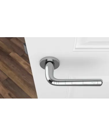 Maniglia per porta su placca rotonda TULIPA maniglia design vista dall'alto montata su una porta