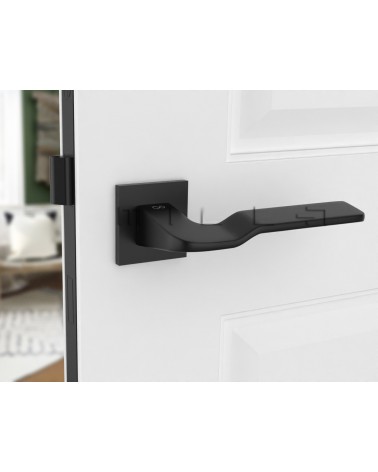 Maniglia per porta in zama LINE BALI ferramenta design montata su una porta socchiusa