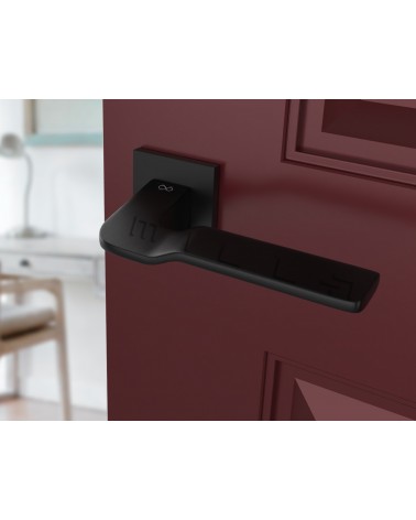 Maniglia per porta in zama LINE BALI ferramenta design vista in prospettiva montata su una porta