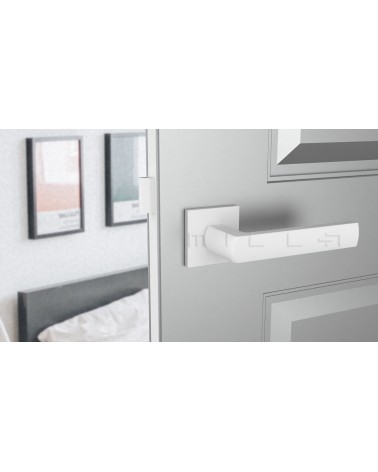 Maniglia per porta in zama HOSTA maniglia design vista frontale montata su una porta