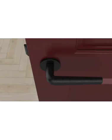 Maniglia per porta su placca rotonda INULLA maniglia design vista dall'alto montata su una porta