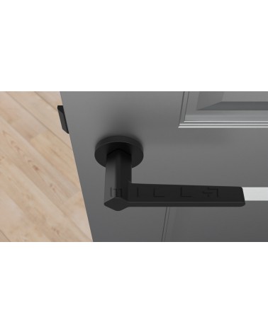 Maniglia per porta su placca rotonda NINFEA ferramenta design vista dall'alto montata su una porta