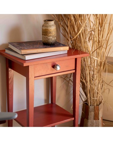 Pomello per mobile in legno di faggio nero design fissato sul cassetto di un mobile