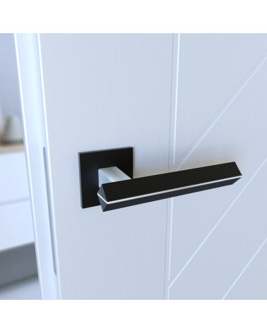 Maniglia per porta in zamak CARRERA maniglia design colore 1 montata su una porta vista inclinata