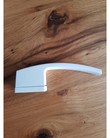 Maniglia per porta futuristica Arc design vista laterale posata su una placca