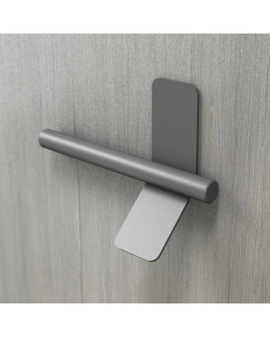 Maniglia per mobile antracite TORN-4 maniglia design fissata su una superficie grigia