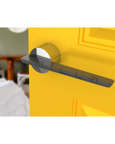 Maniglia per porta in zamak JUMELLE design vista inclinata montata su una porta