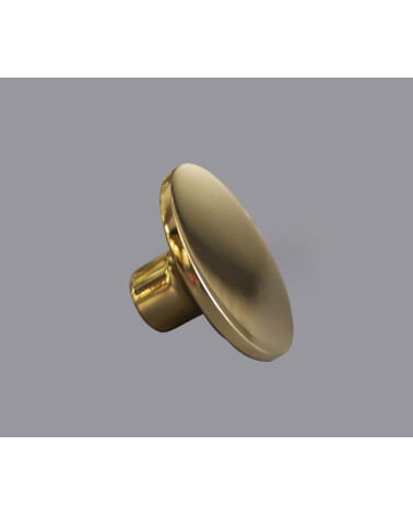 Pomello per mobile oro lucido ASTRO maniglia design su sfondo grigio