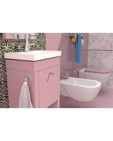 Pomello per mobile CARTAGENA maniglia design fissata su un mobile rosa in un bagno