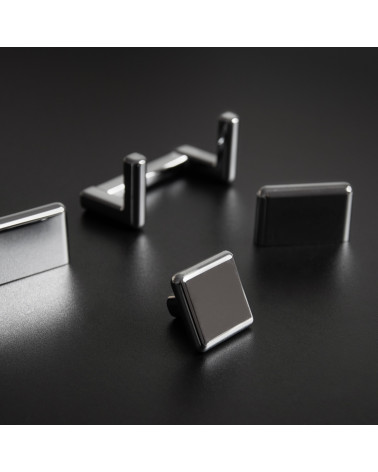 Pomolo per mobile titanio NOX maniglia design presentato su una superficie scura