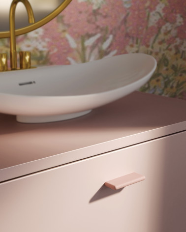 Maniglia per mobile rosa cipria NOX-1 maniglia design montata su un mobile da bagno