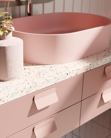 Maniglia per mobile rosa cipria SEA maniglia design montata su un mobile da bagno