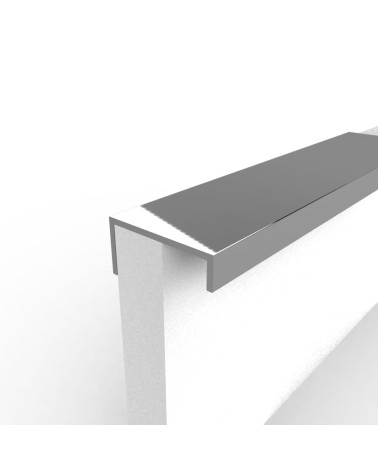 Maniglia per mobile anodizzata naturale VERA design fissata al bordo di un pannello bianco