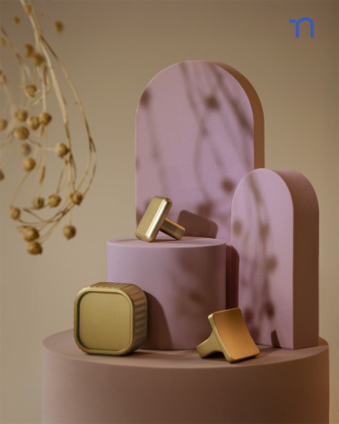 Pomello per mobile oro lucido SIENA maniglia design presentato con altri pomelli